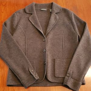 100% Merino wool. Made in Hong Kong.